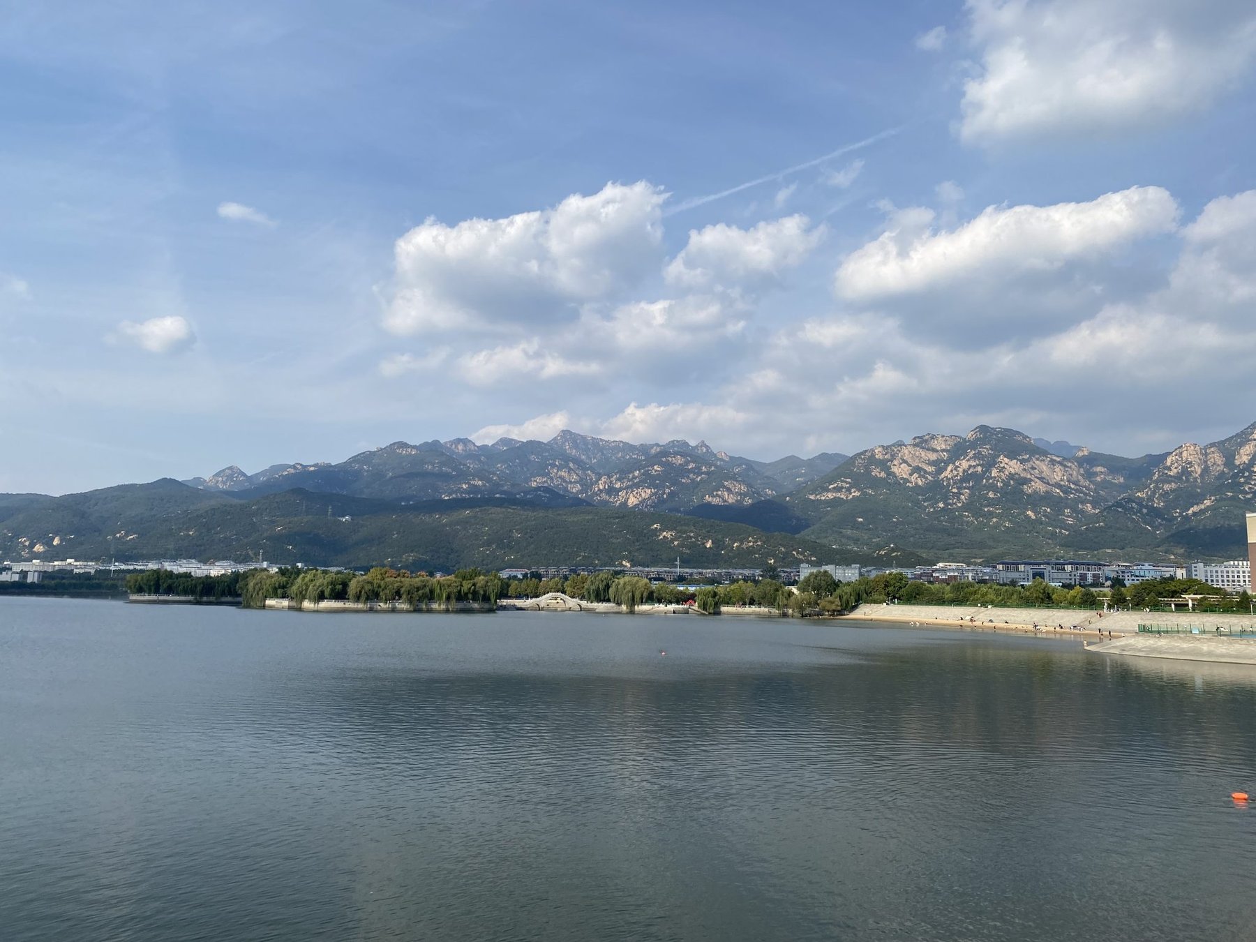 Lake and Mountains Under a Blue Sky