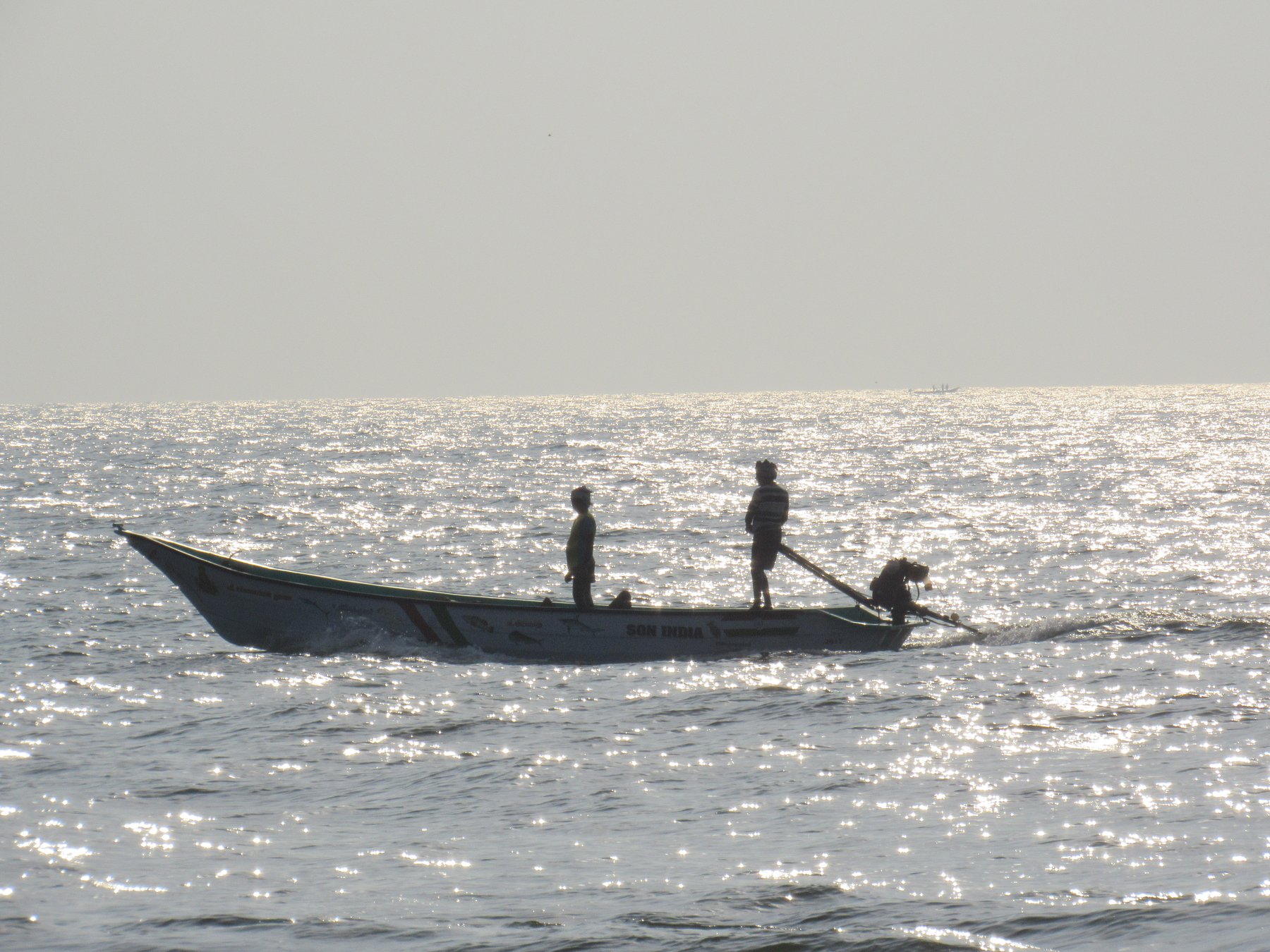 Fishermen on a Shimmering Sea