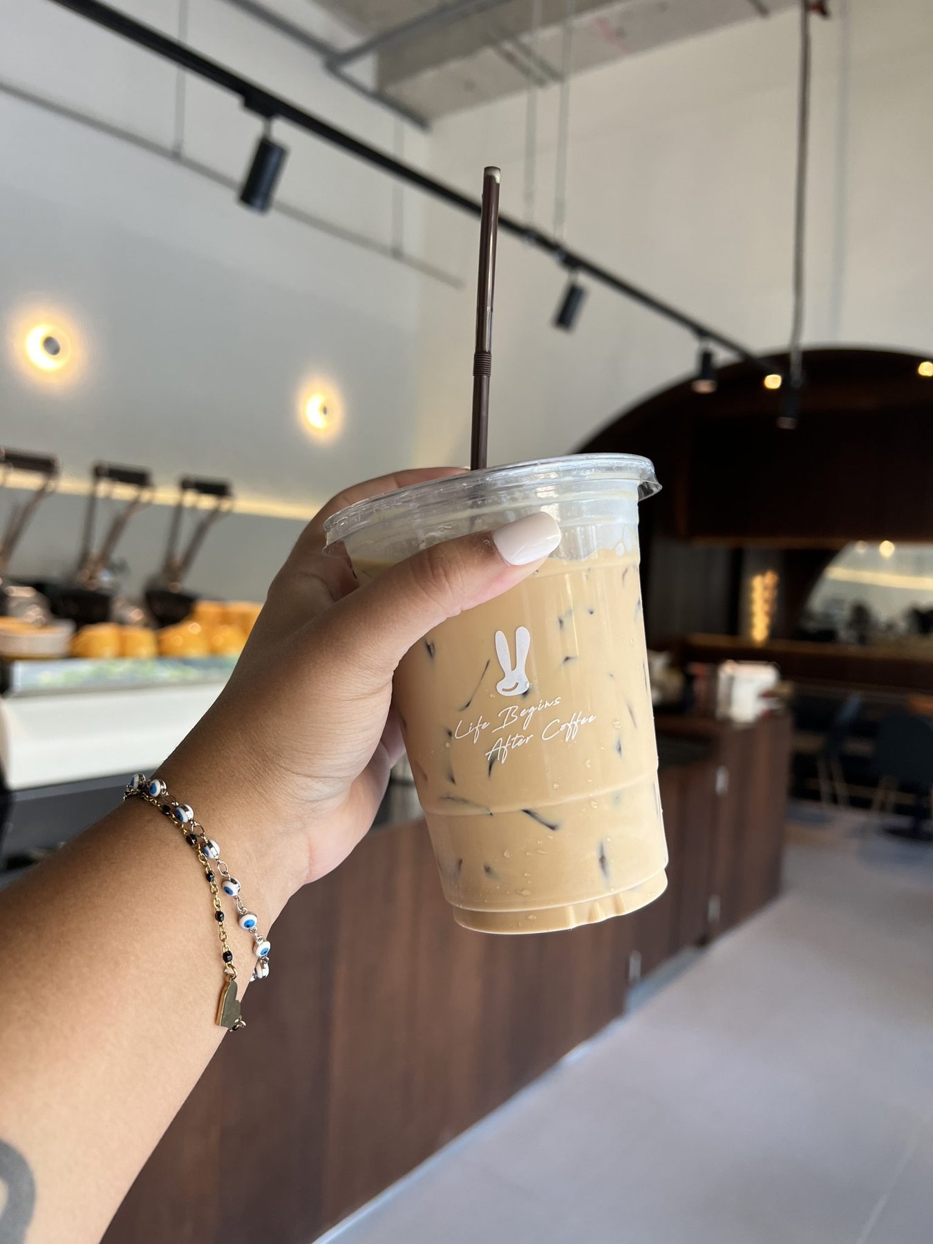 Hand Holding an Iced Coffee