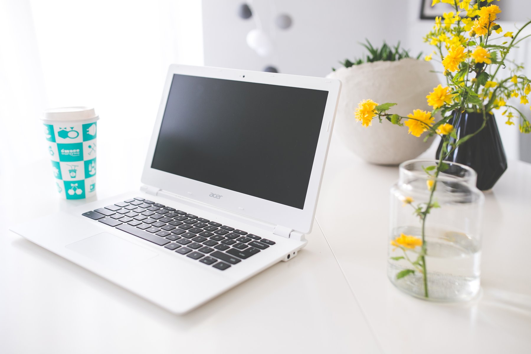 Laptop and Coffee on a Bright Desk